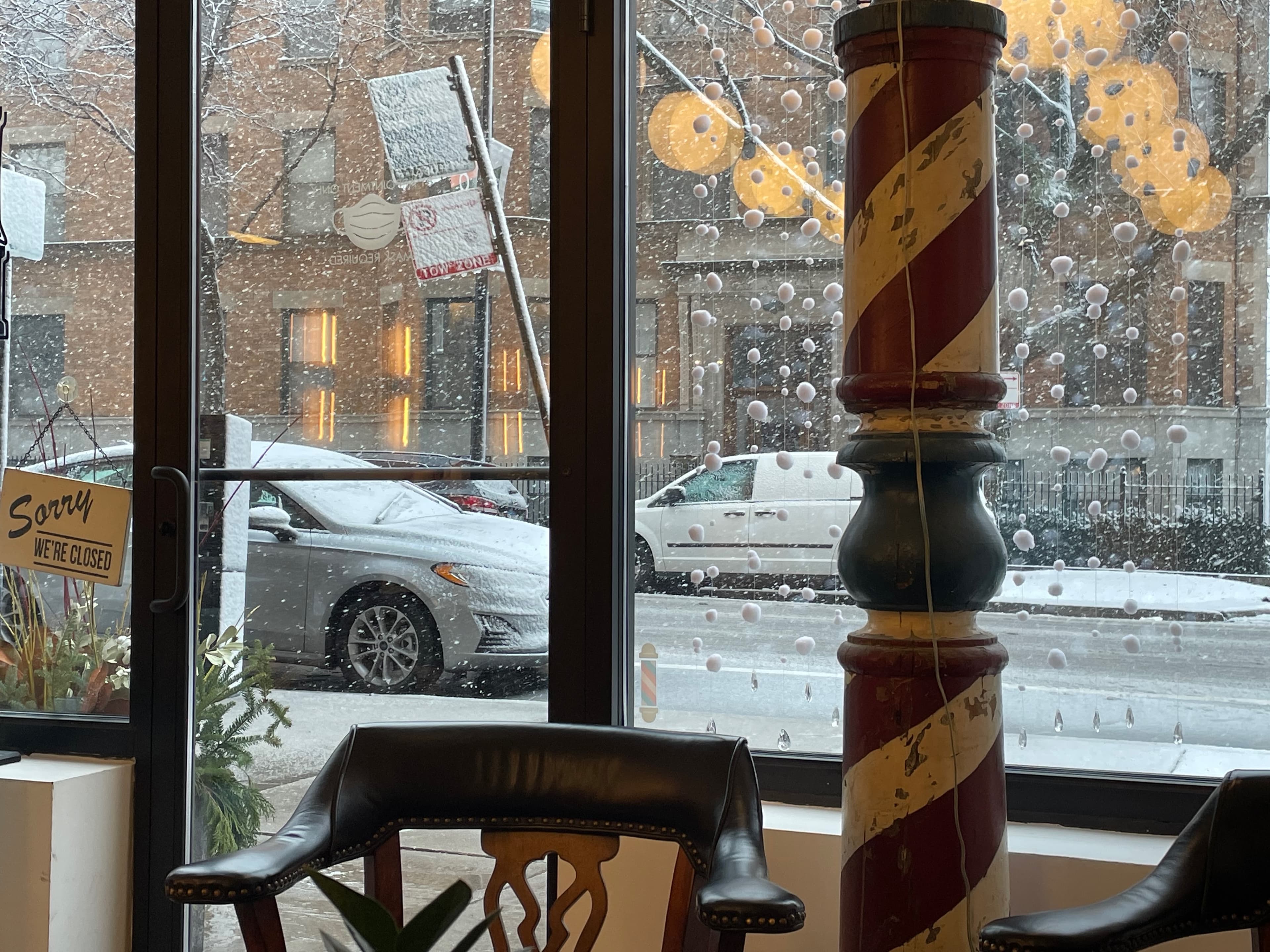 Snowy Day Closed - A barber shop's interior, viewed from inside, show...