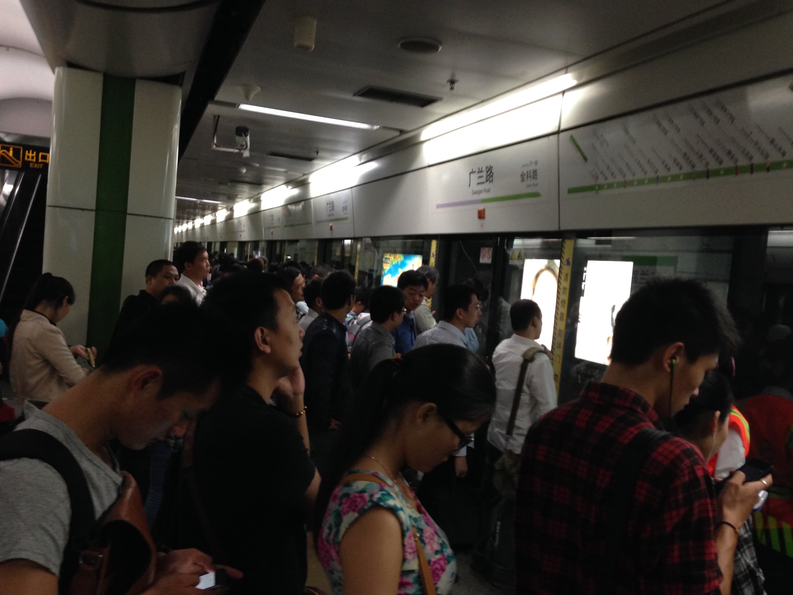 Silent Subway Symphony - Awaiting the train, a sea of faces, each lost in t...