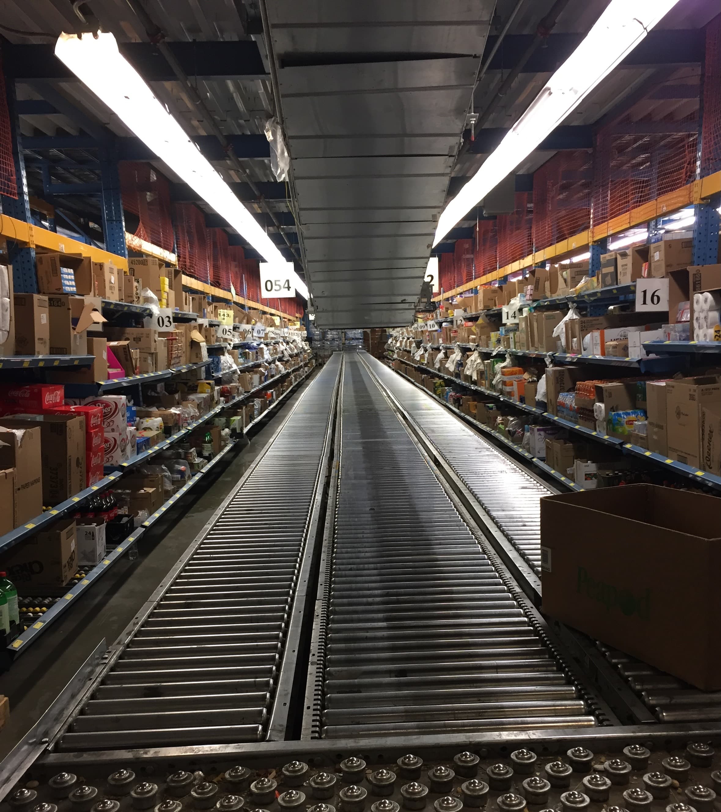 Conveyor Belt to Abundance - A long exposure of a warehouse conveyor system, sh...